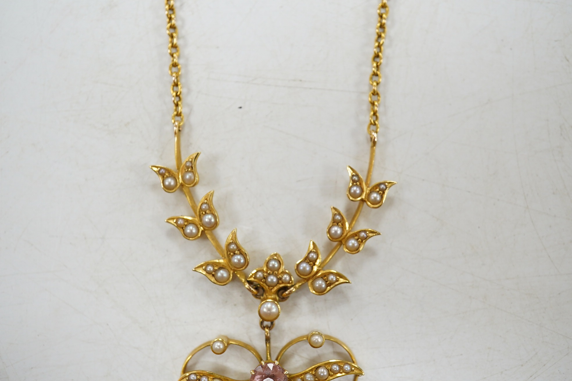 An early 20th century yellow metal and gem cluster set drop pendant necklace, 45cm, gross weight 12.7 grams. Condition - fair to good